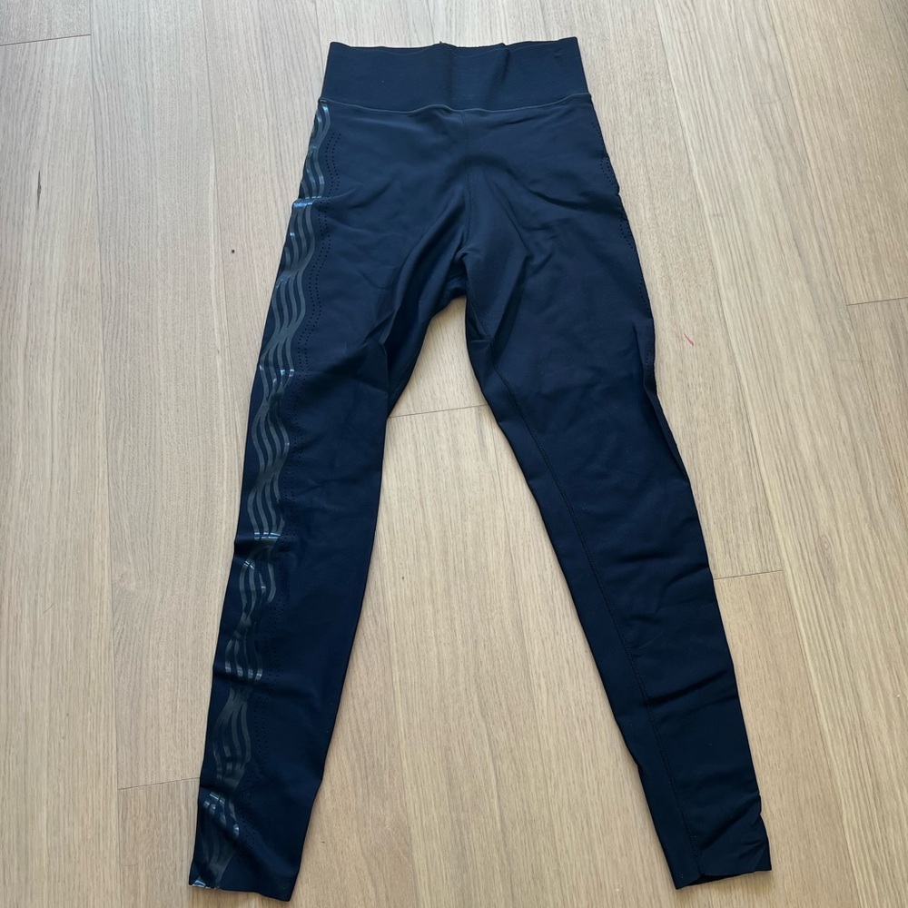 Ultracor Black High-Waisted Leggings with holes and design on sides. Size Medium
